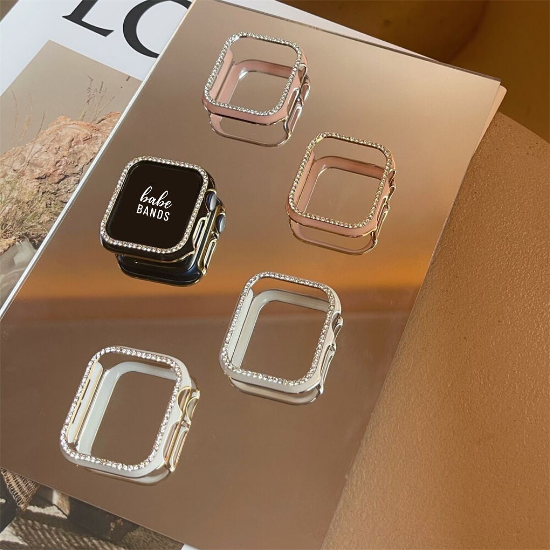 No more basic vibes. Step up your babe game with our premium Babe Bands Case to elevate your Apple Watch style.    Upgrade your Apple Watch with our Premium Single Row Rhinestone Contrast Apple Watch Bumper Case.  Indulge in the luxury look of our Apple Watch case, crafted from high-quality materials including a durable Polycarbonate case with a contrast color trim and a single row sparkling faux diamond border.