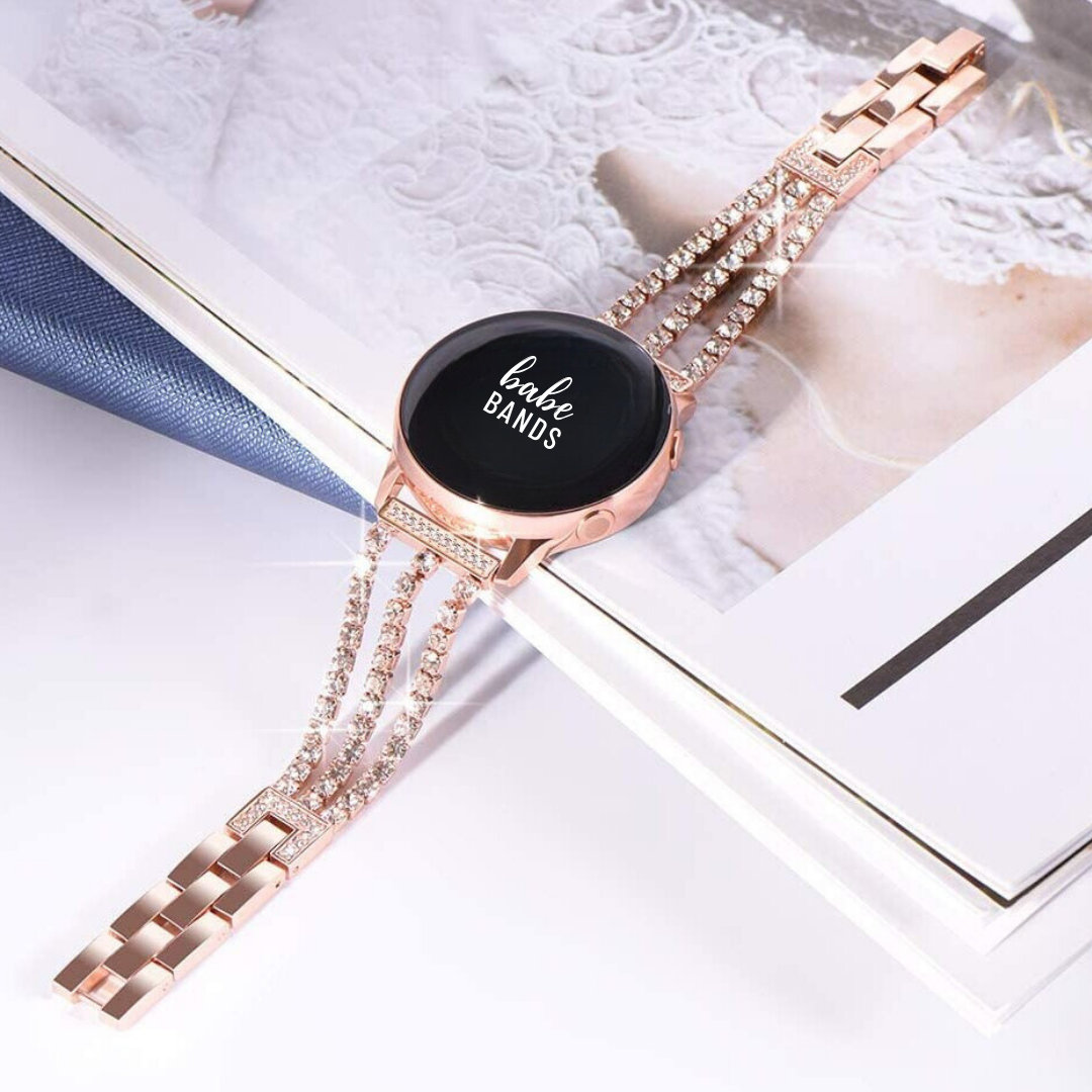 No more basic vibes. Step up your babe game with our premium Babe Bands to elevate your style.   Upgrade your Samsung Galaxy Watch with our Premium Stainless Steel Triple Crystal Strap Samsung Galaxy Watch Band.  Indulge in the luxury look and feel of our Samsung Galaxy Watch band, crafted from high-quality stainless steel in a beautiful triple strap design covered in faux diamonds.