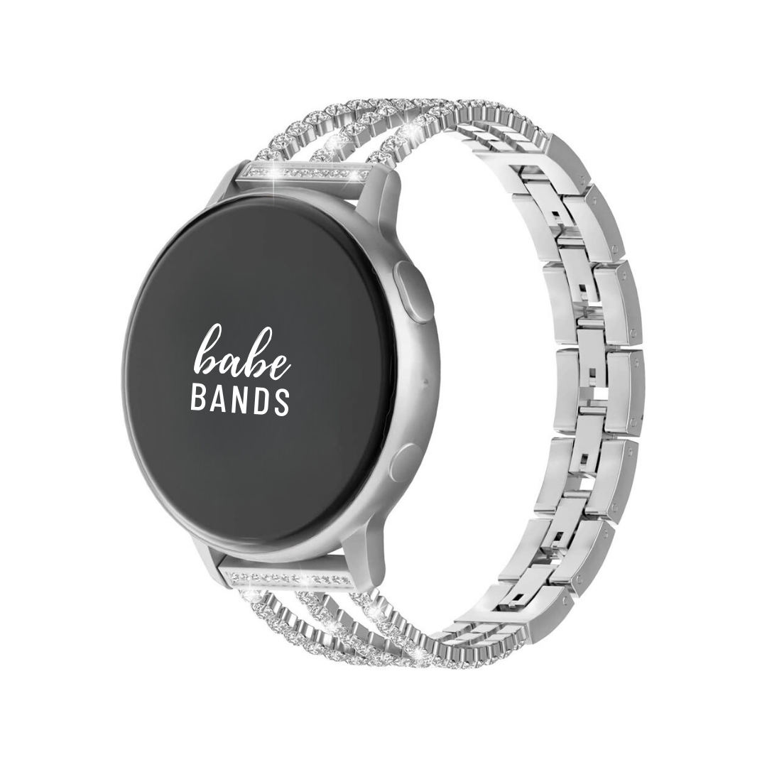 No more basic vibes. Step up your babe game with our premium Babe Bands to elevate your style.   Upgrade your Samsung Galaxy Watch with our Premium Stainless Steel Triple Crystal Strap Samsung Galaxy Watch Band.  Indulge in the luxury look and feel of our Samsung Galaxy Watch band, crafted from high-quality stainless steel in a beautiful triple strap design covered in faux diamonds.