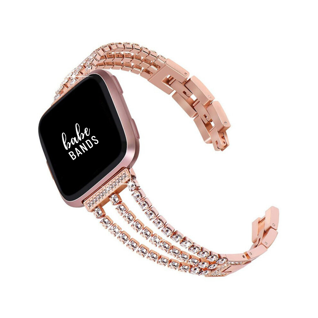 No more basic vibes. Step up your babe game with our premium Babe Bands to elevate your style.    Upgrade your Fitbit Versa or Fitbit Sense with our Premium Triple Crystal Strap Fitbit Versa/Sense Band.  Indulge in the luxury look and feel of our Fitbit band, crafted from high-quality stainless steel in a beautiful triple strap design covered in faux diamonds.